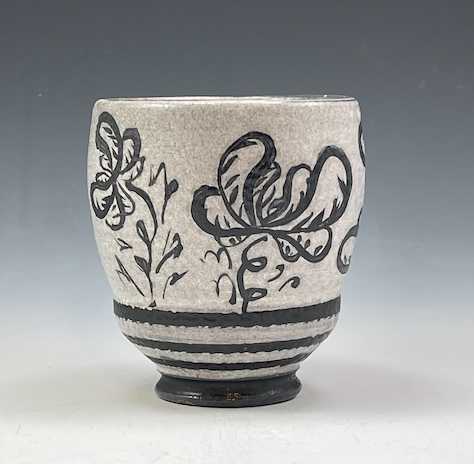 Clay pot with painting on the side