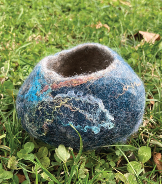 A blue felted bowl