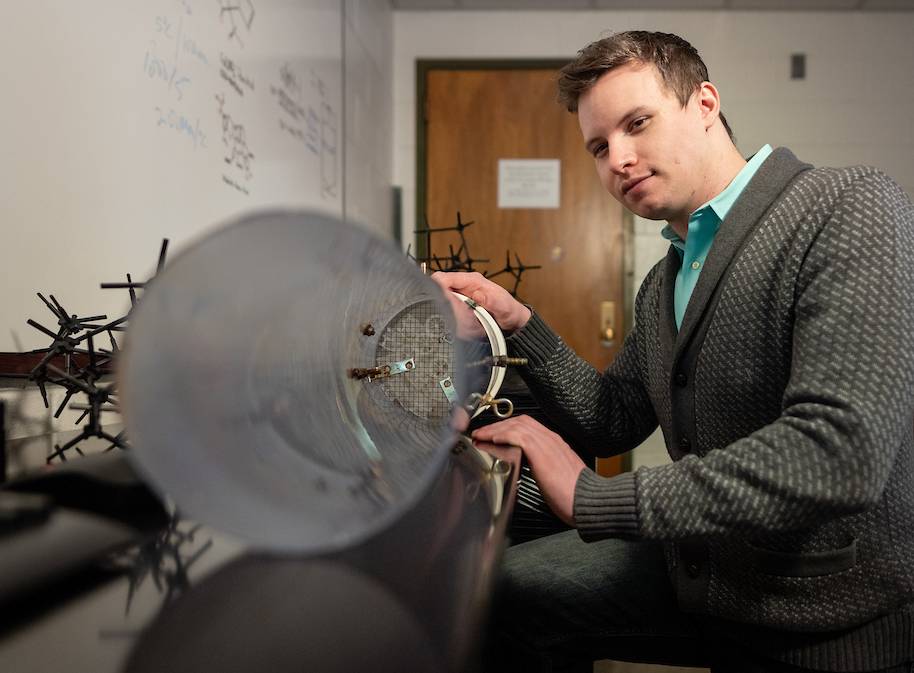 a business student working on an engineering experiment