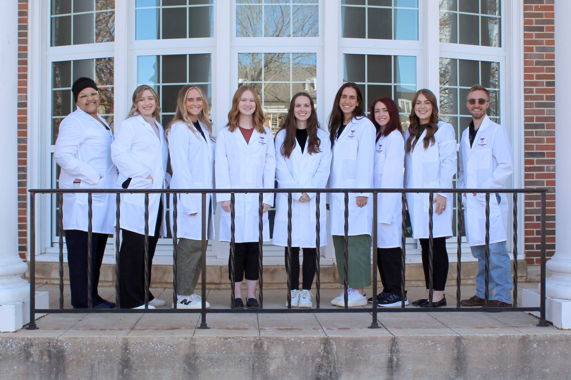 Experiential Learning Students standing in a line in front of Oakley Hall