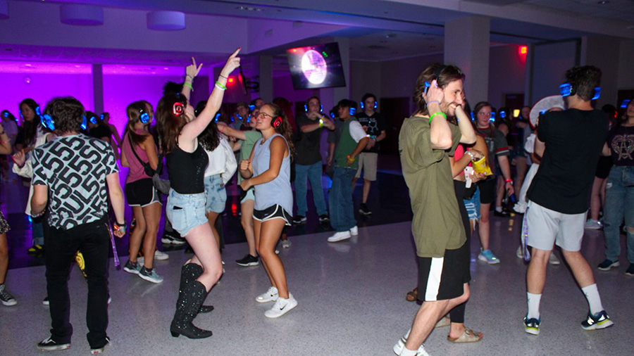 A group of students dancing during a silent disco party.
