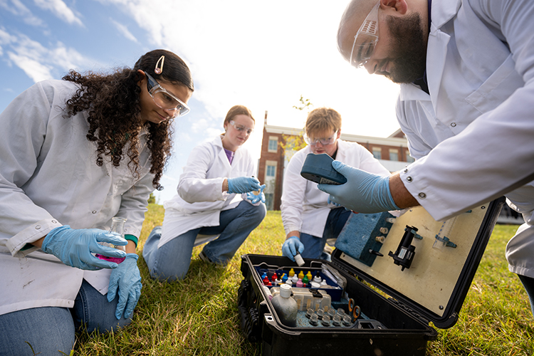 Chemical Engineering students taking pond samples