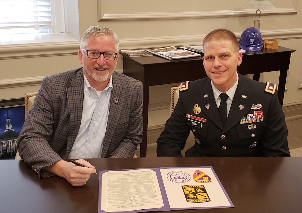  Signing the 10 year ROTC contract, from left, are Tennessee Tech President Phil Oldham and Lt. Col. Adam Grim.