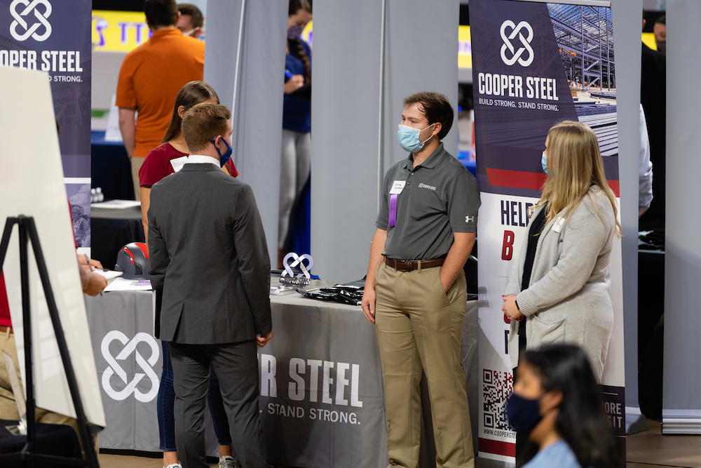 Students talk with employers at a recent career fair.