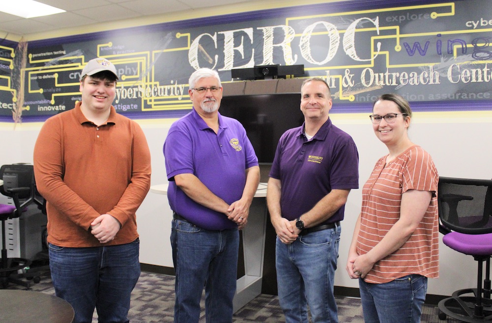 CEROC Interim Director Doug Talbert, second from right, is joined by staff members, from left, Jeremy Potts, Cyber Range engineer; Eric Brown, assistant director; and, at right, Megan Cooper, office and event manager. The team also includes Lana Richardson, project manager, and Travis Lee, Cyber Range engineer.