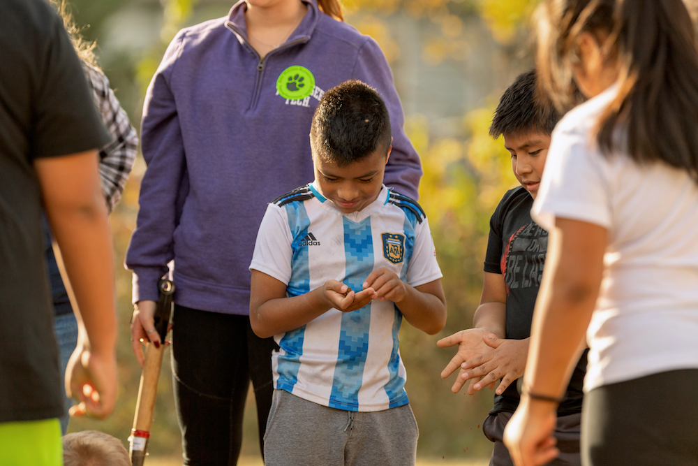 Jere Whitson Elementary Students work with seeds in the school garden.