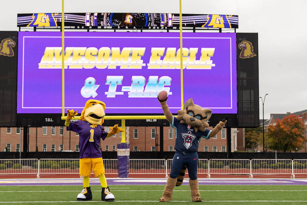 Tennessee Tech mascot Awesome Eagle and Titans mascot T-Rac celebrate in Tech's Tucker Stadium.