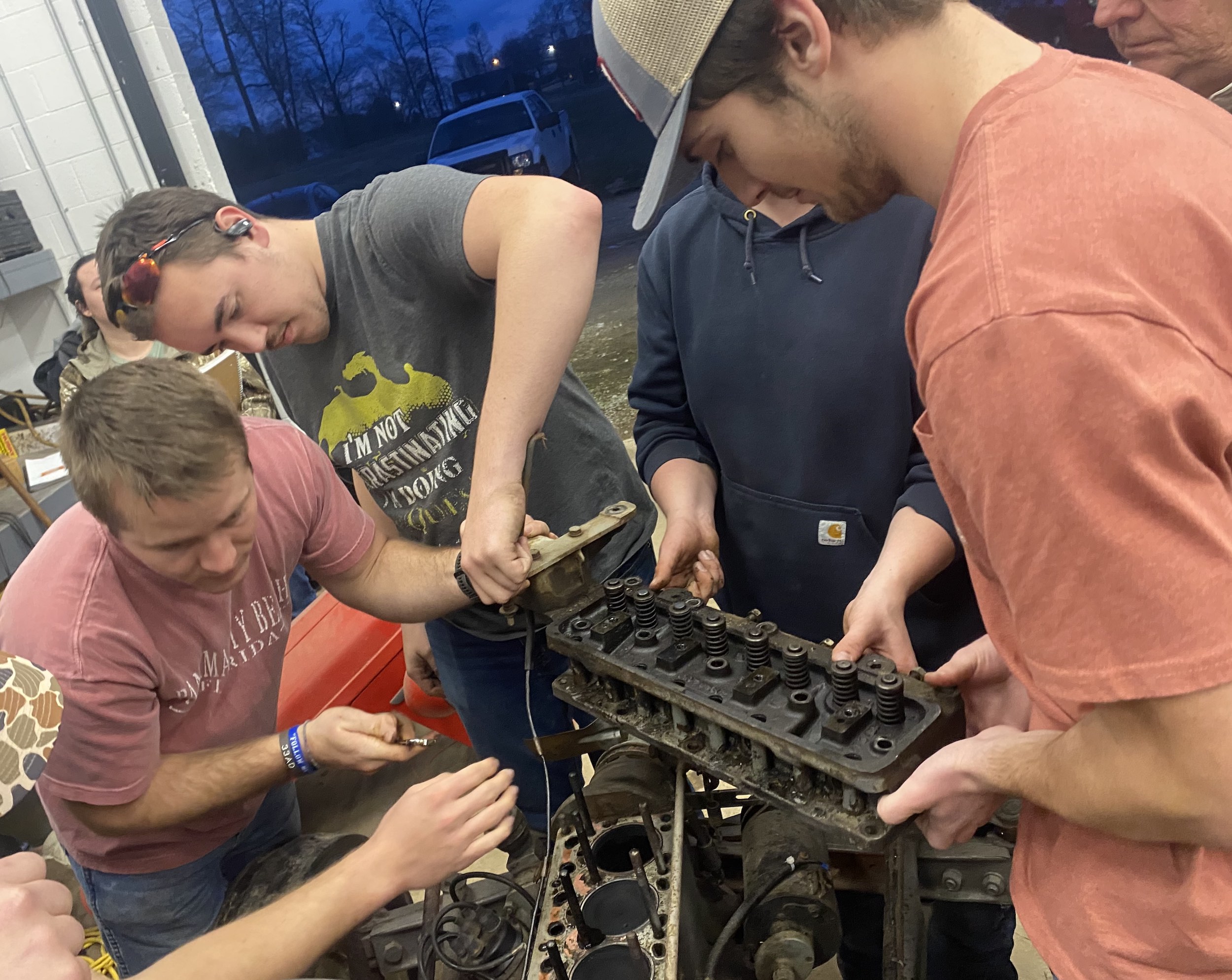 Students working on tractor