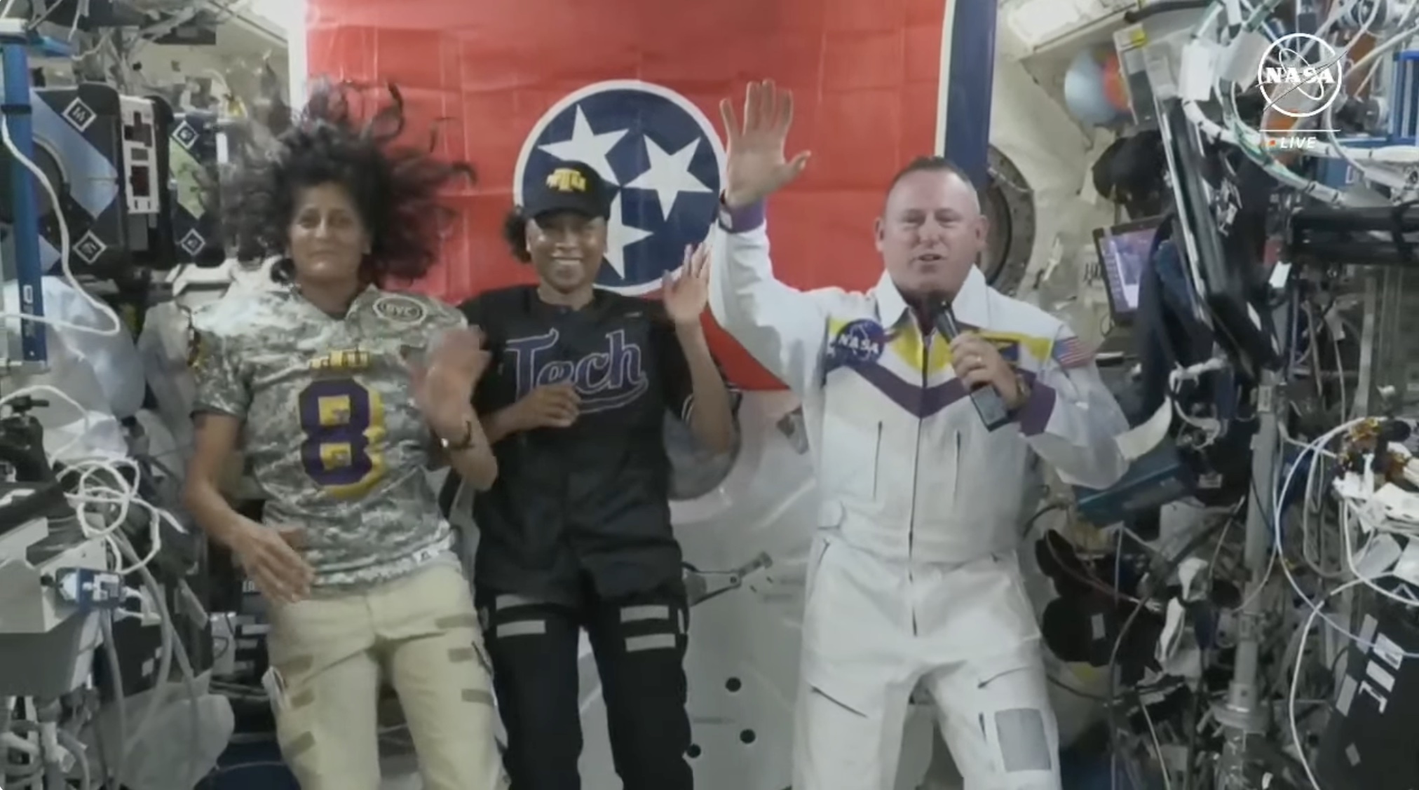 From left: Astronauts Suni Williams and Jeannette Epps join Tennessee Tech alumnus and trustee Barry “Butch” Wilmore for his June 11 video chat from the International Space Station with the children of Tech faculty and staff. Williams wears a Tech football jersey while Epps appears in a Tech baseball uniform. Photo: Screengrab of live event via NASA TV.