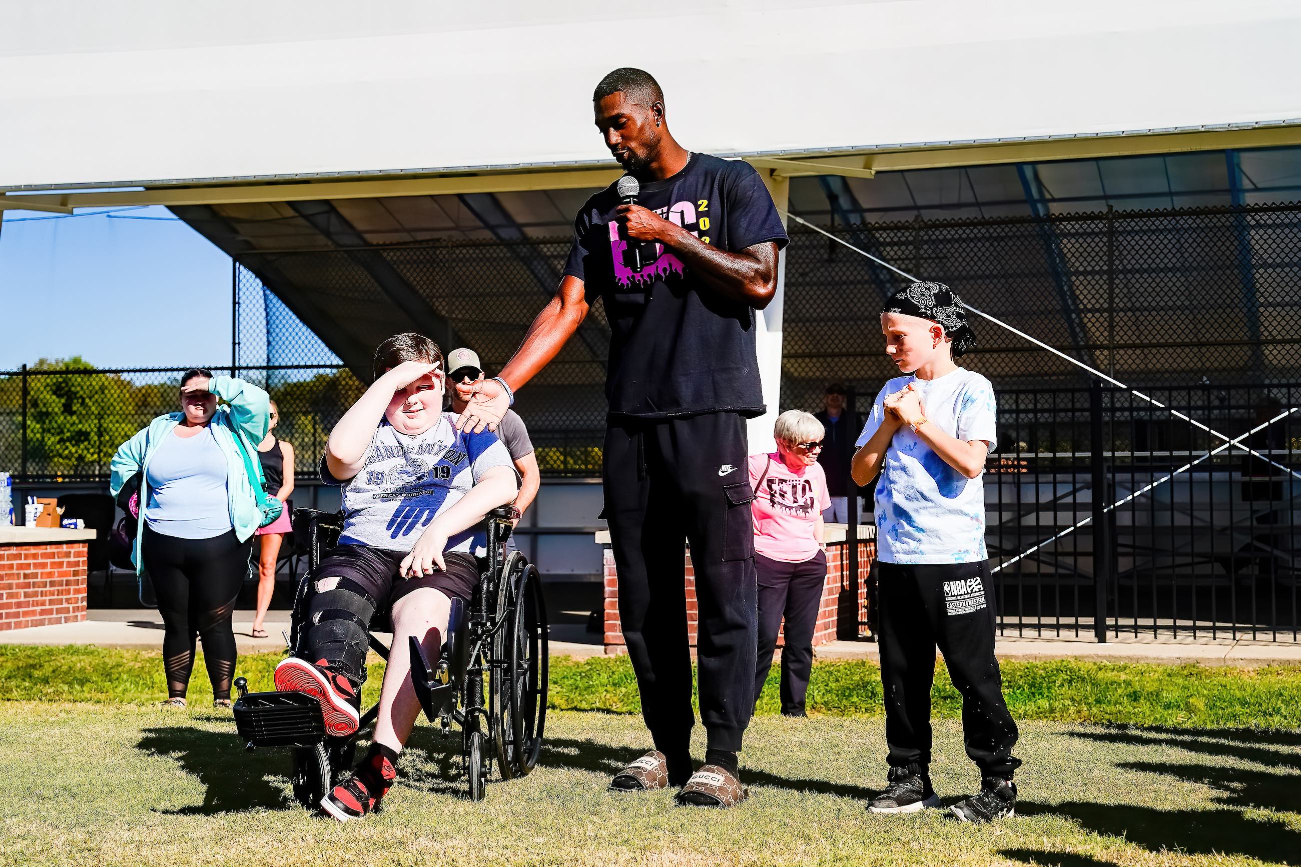 Jameson Wharton speaks as he is flanked by the two young Sumner Countians who will benefit from the funds raised at this year’s Football for the Cure event: Liam (left) and Jason (right). Photo by Christina Moore.