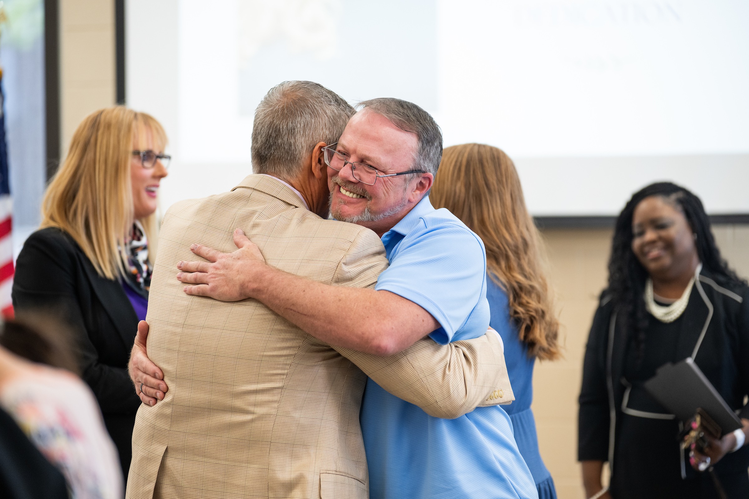 Michelle Huddleston’s husband, Ray, shares a hug with former Cookeville Mayor Ricky Shelton at the Michelle Huddleston Memorial Food Pantry April 15 dedication ceremony. As mayor, Shelton presented Huddleston with an honorary key to the city. Michelle Huddleston’s husband, Ray, shares a hug with former Cookeville Mayor Ricky Shelton at the Michelle Huddleston Memorial Food Pantry April 15 dedication ceremony. As mayor, Shelton presented Huddleston with an honorary key to the city.