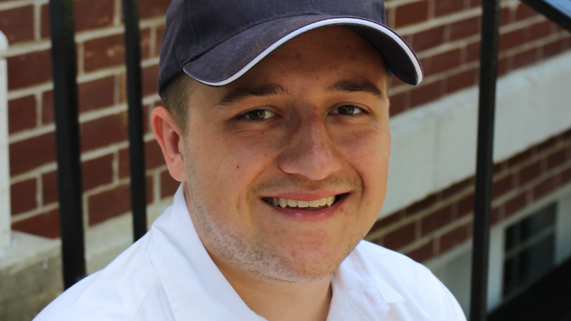 Tanner Cox Tanner Cox wears a hat and smiles.