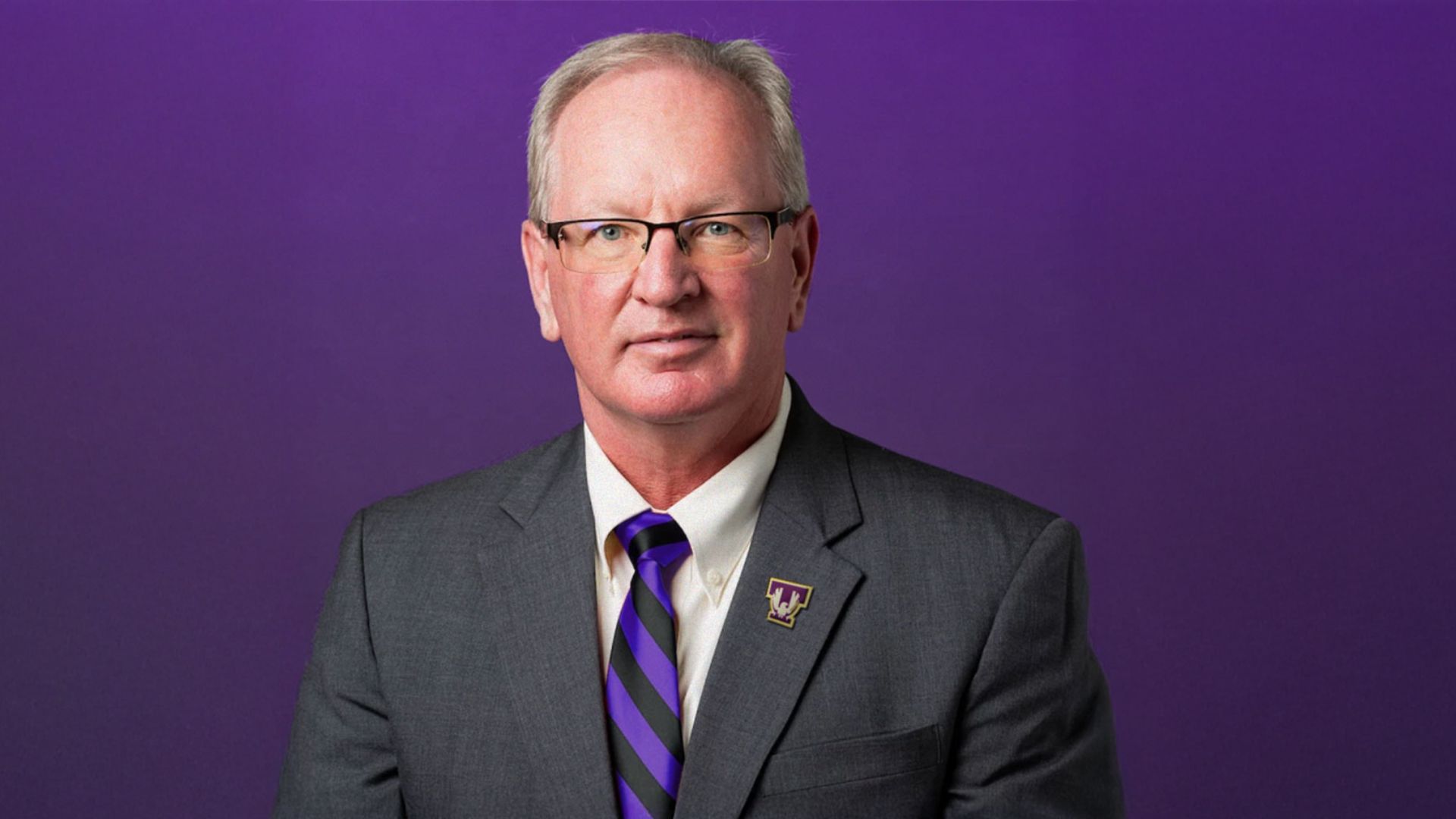 Dr. Mickey A. Latour Headshot of Dr. Mickey Latour in a suit against a purple background