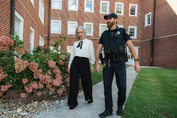 Officer walking with employee