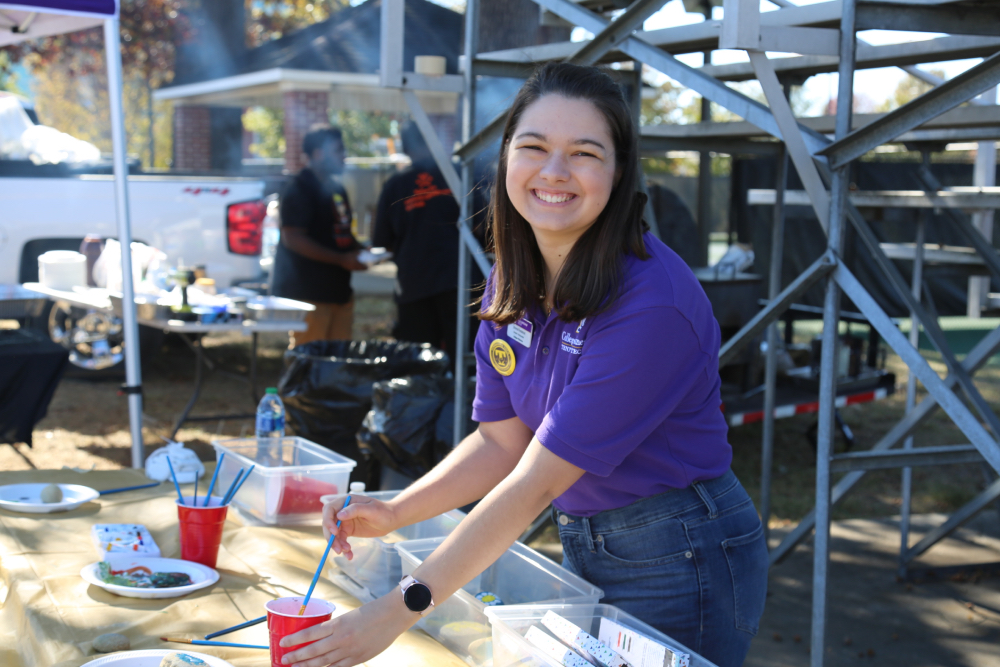 Emma Fontenot works a booth at a Tech event.